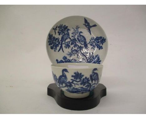 A late 18th century Worcester Birds in Branches pattern blue and white tea bowl, 3" dia and saucer, 4 3/4"dia with a blue cre