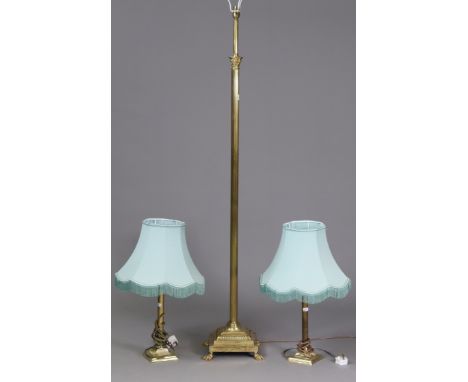 A brass standard lamp with a Corinthian-style centre column &amp; on a square stepped base with claw feet; &amp; a similar pa