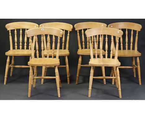 A set of six spindle-back kitchen chairs with hard seats, &amp; on ring-turned legs with turned stretchers.