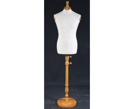 A cream fabric-covered mannequin on a turned beech stand, 176cm high