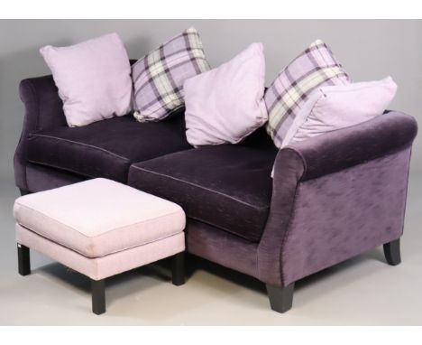 A modern three-seater sofa with down-swept arm supports, upholstered in mauve fabric, on ebonised square tapered legs, 217cm 