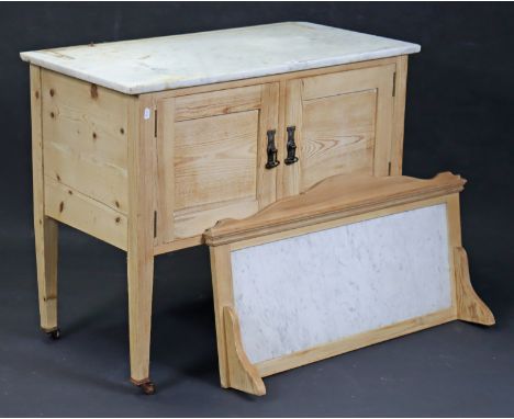 A pine marble-top washstand with inset marble panel to the stage back, enclosed by a pair of panel doors, &amp; on square tap