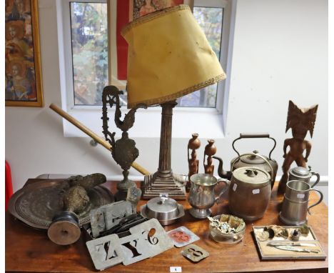 A large silver-plated Corinthian-style table lamp, with shade, 60cm high (overall); a copper oval kettle; three eastern trays