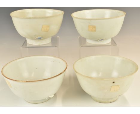 Four&nbsp;Chinese Kangxi period pedestal bowls with ivory / celadon glaze, from the Vung Tau Cargo, some with original Christ