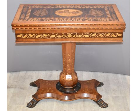 19thC Irish Killarney marquetry and yew games table, the hinged rectangular top inlaid with an oval reserve of Muckross Abbey