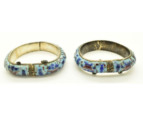 A pair of Chinese silver bangles set with enamel depicting auspicious symbols, diameter 7.5cm, weight 84.7g&nbsp;