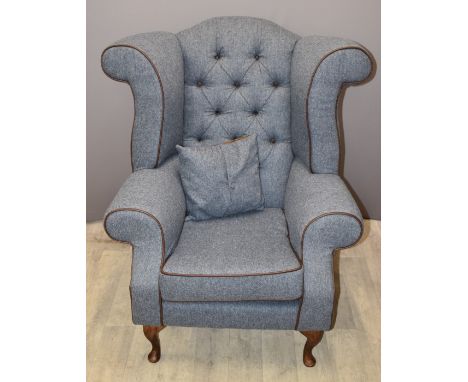 Wing back armchair with button back and cushion, raised on cabriole legs, recently upholstered in blue wool tweed