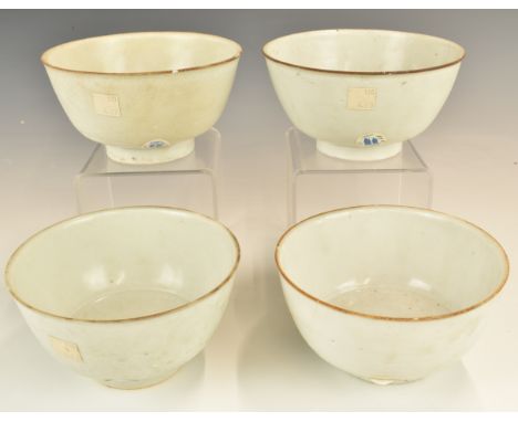 Four&nbsp;Chinese Kangxi period pedestal bowls with ivory / celadon glaze, from the Vung Tau Cargo, some with original Christ