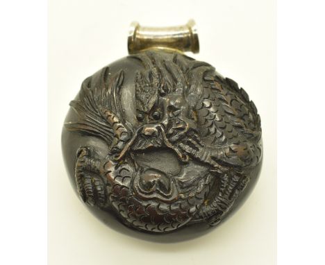 Japanese wooden netsuke carved with a dragon and inlaid signature, on silver pendant mount, 29.6g, 4cm diameter&nbsp;