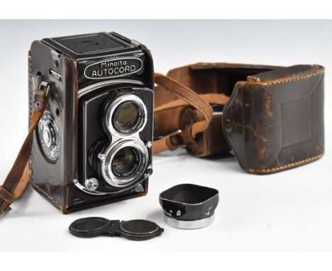 Minolta Autocord TLR camera with 75mm 1:3.5 lens, in leather case with lens cap and hood