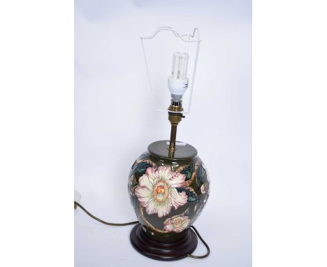 Moorcroft table lamp with tube lined floral design with beige shade