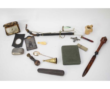 Small plastic bag containing quantity of various smoking implements, letter opener, small pottery model of Nelson etc