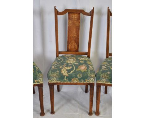 Set of four late Victorian mahogany framed dining chairs, the backs decorated with inlaid Art Nouveau style floral detail, th
