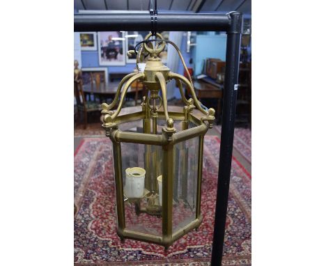 Hexagonal brass and glass mounted lantern light fitting with three internal electric lights, 48cm high max