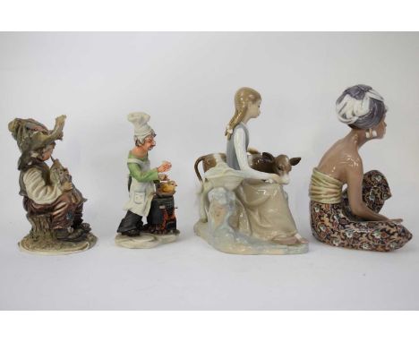 Lladro figure of a girl with heifer on shaped base and a further Lladro model of a young girl and two further porcelain model