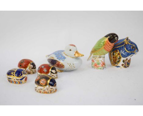Quantity of Royal Crown Derby paperweights, one black faced love bird signed by Sue Rowe, also a Japanese porcelain model of 