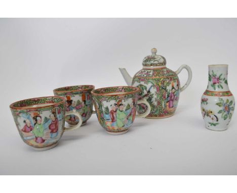 Group of Cantonese famille rose wares including small tea pot, three cups and small vase, all with typical famille rose type 