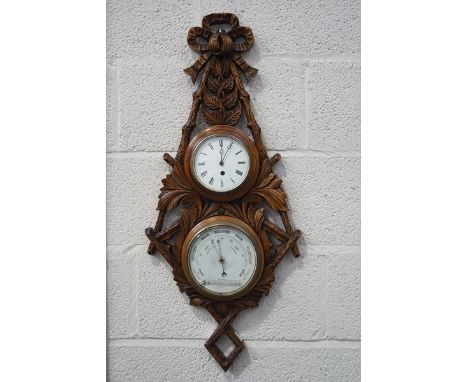 A Victorian double barometer and clock, set in an oak surround carved as foliage and a ribbon bow, 86cm high