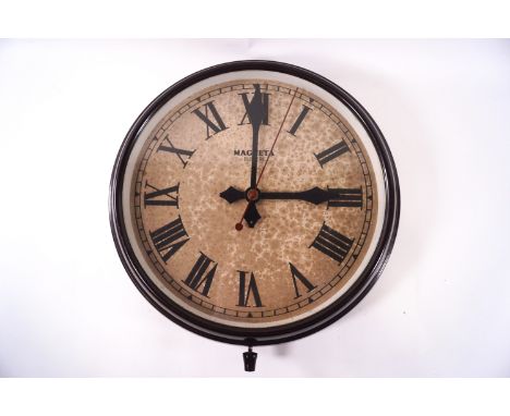 A Magneta brown bakelite electric wall clock, 37cm diameter