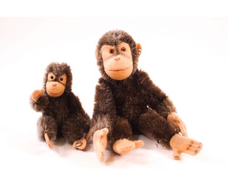 Two Steiff figures of monkeys, one with a button to ear, 16.5cm high, and another with button to foot, 10cm high