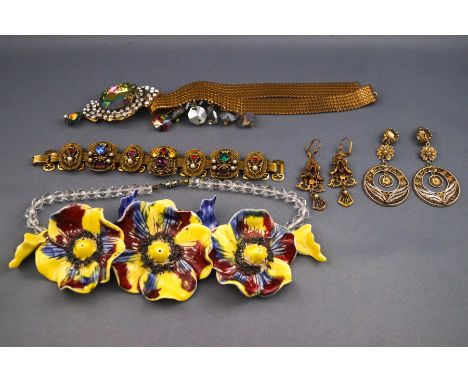 A small quantity of costume and other jewellery to include a gilt gem set panel bracelet with earrings, a cultured freshwater