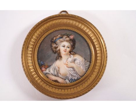 A 19th century French portrait miniature of a Lady with a dove, watercolour on ivory, signed Duissont (?), 6.5cm 