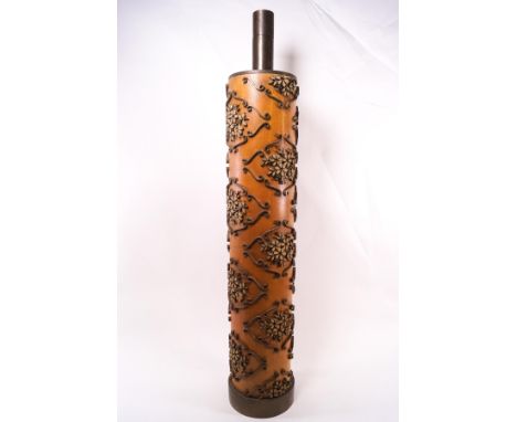A 20th century wooden and brass mounted table lamp by M Lethbridge, in the form of a wallpaper stencil with applied brass scr