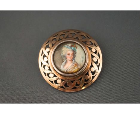 A sterling silver brooch set with a miniature hand painted portrait. Pin and sleeve fitting. 12.9 grams