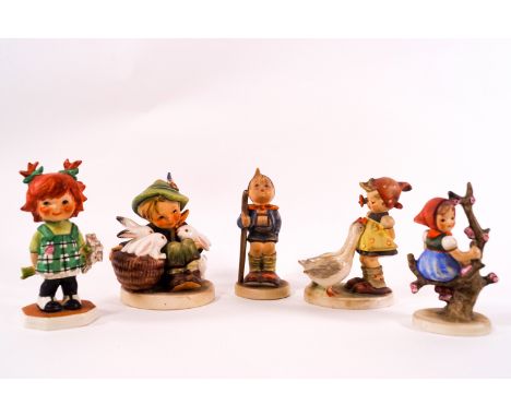 Five Goebel Hummel figures including a red headed girl holding a bunch of flowers