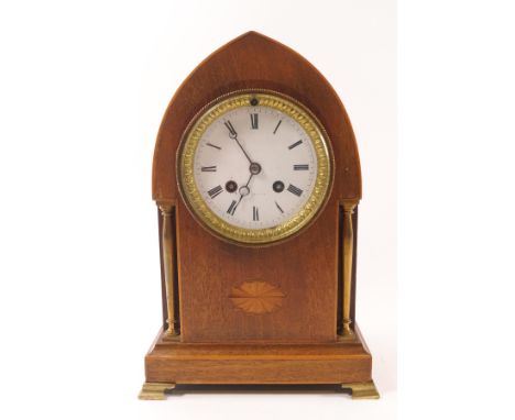 An Edwardian mahogany mantel clock of lancet shape, the eight day movement striking on a bell, 29cm high