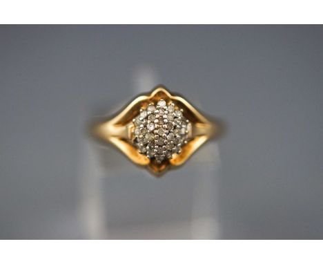 A 9ct gold and diamond cluster ring, the 34 eight-cut, rose cut and single-cut stones (one missing) claw set to a domed head,