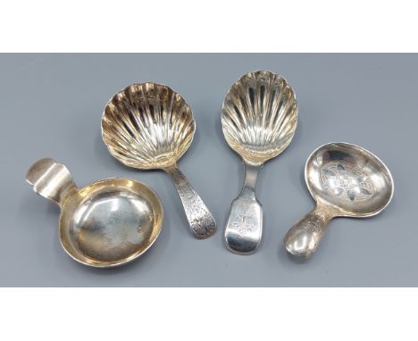 A William IV silver caddy spoon, London 1830, maker William Eaton together with three other caddy spoons