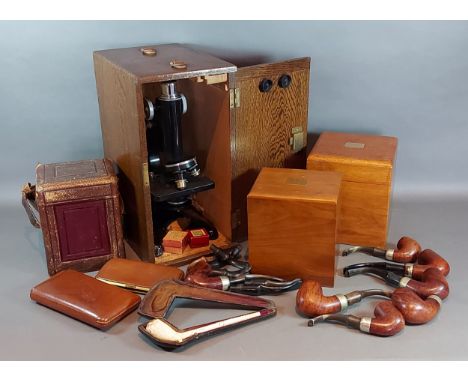An oak cased microscope by R&amp;J Beck with accessorises together with two walnut cigar humidors, a collection of pipes and 