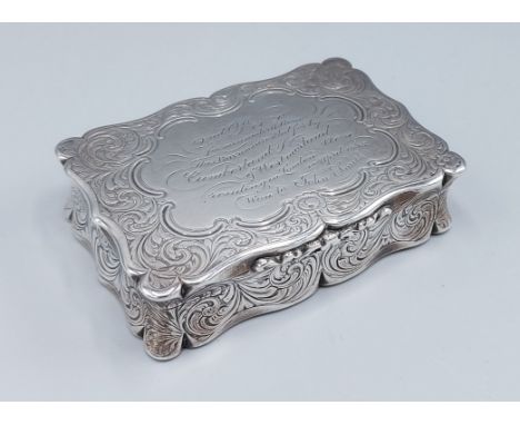 A Victorian presentation silver snuff box, the hinged cover enclosing a silver gilt interior, Birmingham 1856, makers mark ES