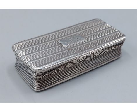 A Georgian silver snuff box with engraved decoration, 7cms long, Birmingham 1825