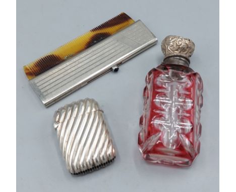A Birmingham silver Vesta case together with a silver mounted scent bottle and a cased comb 