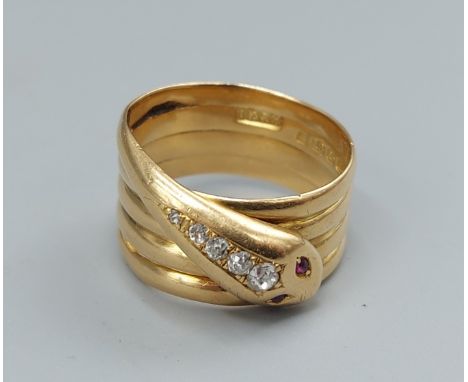 An 18ct gold ring in the form of a snake, the snakes head set with Ruby eyes and graduated Diamonds, 9gms, ring size Q