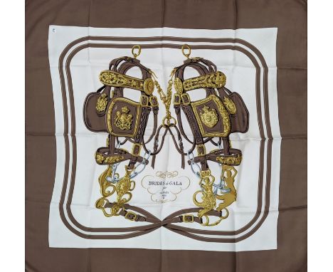 HERMÈS SCARF 'BRIDES DE GALA', designed by Hugo Grygkar and first issued in 1957 with horsebit equestrian design, silk, rolle