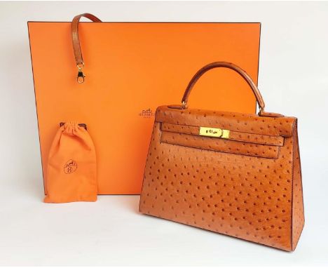 HERMÈS KELLY SELLIER 32 OSTRICH, gold tone hardware, top handle, color matching leather lining, one zip pocket, one double pa