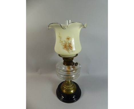 A Late Victorian Brass Mounted Oil Lamp with Glass Reservoir, Chimney and Shade, 49cm High 