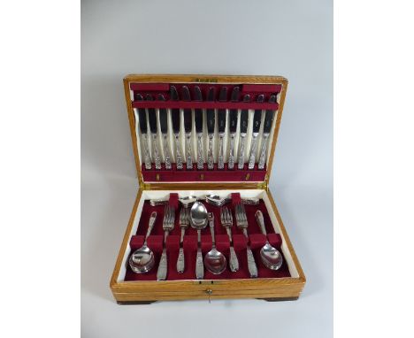 An Edwardian Light Oak Canteen Containing Staybrite Cutlery