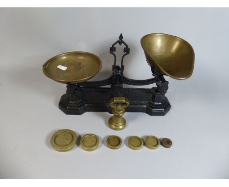 A Pair of Cast Iron Kitchen Scales by WT Avery, with Brass Pans and Weights
