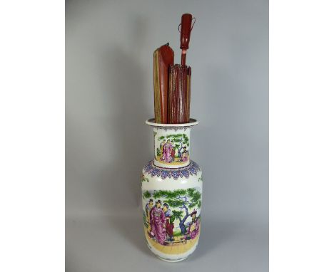 An Oriental Stick Stand Containing Two Oriental Parasols and Large Fan Decorated with Peacock.