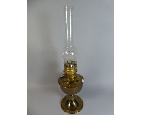 A Brass Aladdin Oil Lamp with Glass Chimney. 59cm High