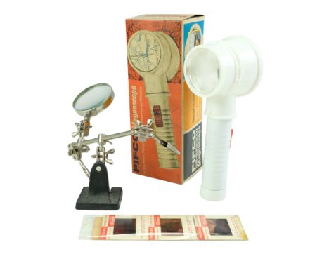 A vintage boxed Pifco Magnascope together with a combined magnifier and clamp