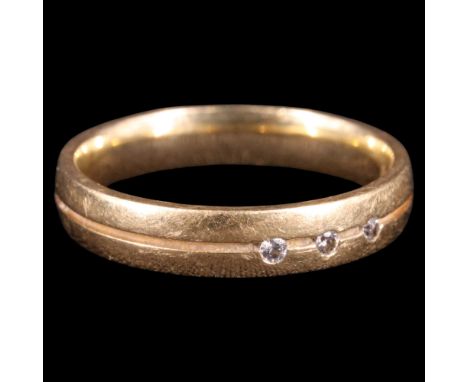 A contemporary Modernist diamond and 18 ct gold double band, the ring flush-set with three diamond brilliants of approx 0.06 