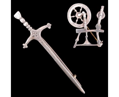 An Ian McCormick / Celtic Art Industries Iona white metal brooch in the form of a Scottish claymore sword, 8 cm, together wit