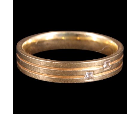 A contemporary Modernist diamond and 18 ct gold triple band, the ring flush-set with two square-cut stones of approx 1 mm x 1