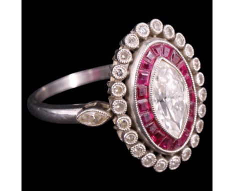 A fine ruby and diamond ring, comprising a central marquise-cut diamond of approx 1 ct, millegrain-set within a circuit of tr