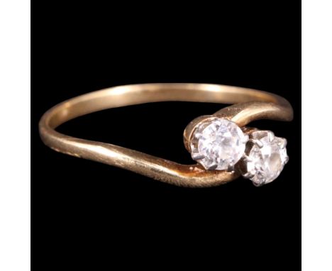A vintage two-stone diamond ring, comprising brilliants of approx .3 ct aggregate weight twist-set on an 18 ct yellow metal s
